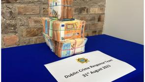 Man and woman arrested on suspicion of money laundering after large sum of cash is seized