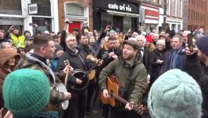 WATCH: Crowds gather as buskers belt out Shane MacGowan hit on streets before funeral