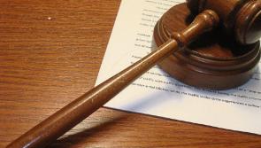 Men charged in connection with armed robbery where customer was held at knifepoint