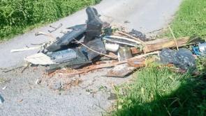 Locals forced to move illegally-dumped waste blocking rural road in Parteen