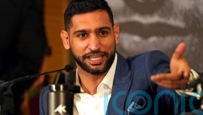 Three men charged after boxer Amir Khan &lsquo;robbed at gunpoint&rsquo;