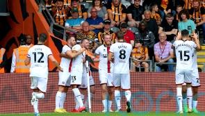 Blades win at Hull to go top of the Championship