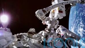 Two Chinese astronauts complete spacewalk from new space station