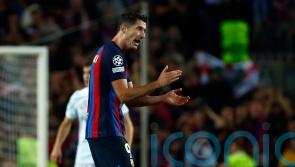 Robert Lewandowski scores late equaliser to give Barcelona Champions League hope