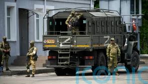 Ukraine cautious as Russia begins retreat from key city