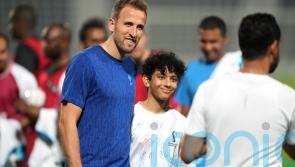 Today at the World Cup: England squad meets migrant workers