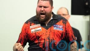 Michael Smith wins first major title after emphatic Grand Slam of Darts victory