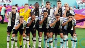 Germany players cover mouths for team photo in protest over OneLove armband ban