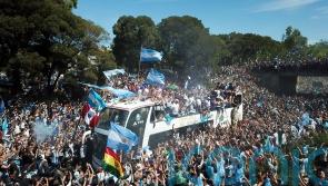 Argentina forced to swap bus for helicopters as fans swarm streets during parade