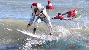 Frigid weather fails to stop Florida&rsquo;s surfing Santas