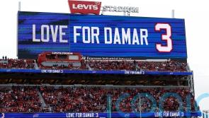 Damar Hamlin remains in hospital but &lsquo;is in good spirits&rsquo; after cardiac arrest