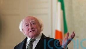 President Higgins enjoys Derry City match despite security alert disruption