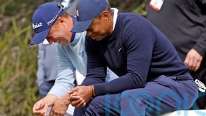 Tiger Woods gives tampon to playing partner Justin Thomas after outdriving him
