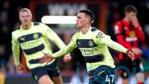 Four-goal Manchester City keep pressure on Arsenal after easing past Bournemouth