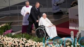 Pope celebrates Easter with big crowd in flower-adorned Vatican square