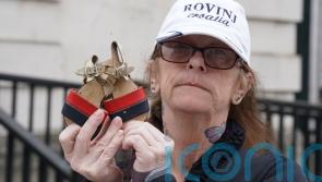 Bereaved family members lay shoes of loved ones in protest against legacy Bill