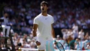 Top seed Carlos Alcaraz battles into third round at Wimbledon