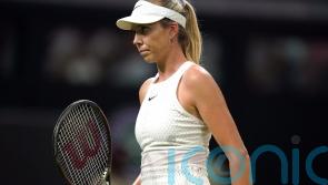 Wimbledon fans endure dark and damp conditions to cheer on Katie Boulter