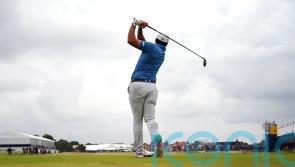 Early starters battle overcast conditions as Tommy Fleetwood shares Open lead
