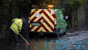 Children carried out of flooded school amid heavy rainfaill in Ireland