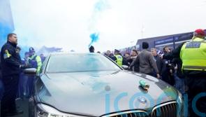 Car carrying Delia Smith hit with beer can as it arrives for football derby