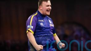 Luke Littler continues dream World Championship with victory over Andrew Gilding