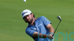 Cameron Young leads the way at Dubai Desert Classic as Rory McIlroy falls back