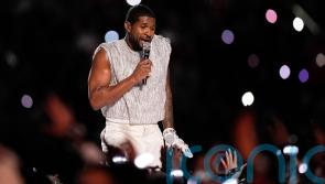 Usher performs medley of hits at Super Bowl half-time show beside special guests