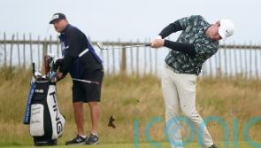 Early starters take advantage of favourable conditions at Open