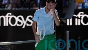 Daniil Medvedev smashes net camera in anger during five-set Australian Open win