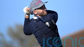 Wyndham Clark grabs two-stroke lead as wind hits first round