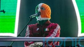 Kneecap apologises to families of murdered MPs after concert video clip furore