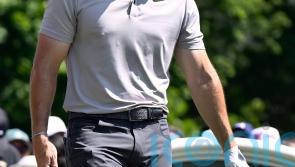 Rory McIlroy trails by two as Scottie Scheffler holds share of lead