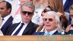 Hugh Grant and the Queen among famous faces in crowd during day 10 of Wimbledon