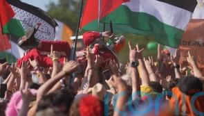 Kneecap and Brian Eno call on artists to join syndicate to support Palestine