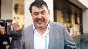 Father Ted creator Linehan arrives at court for trans activist harassment trial