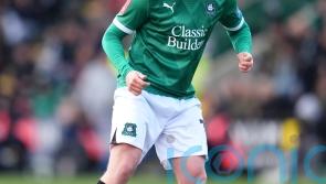 Lincoln and Wigan share spoils as both sides see red