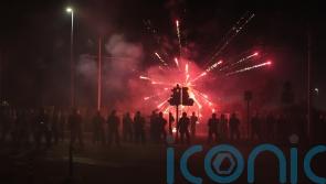 Fireworks and stones thrown at police for second night at asylum seeker hotel