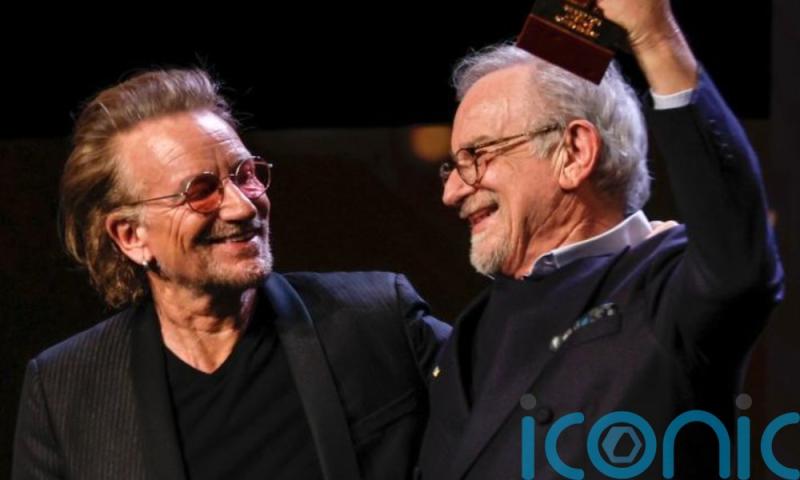 Bono presents legendary filmmaker with special award at film festival