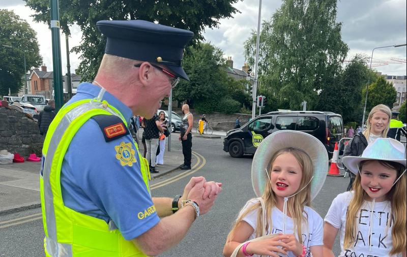 Cute moment young Taylor Swift fans gift garda a friendship bracelet at Dublin gig