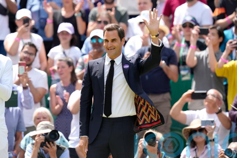 Centre Court gives Roger Federer standing ovation during centenary celebration