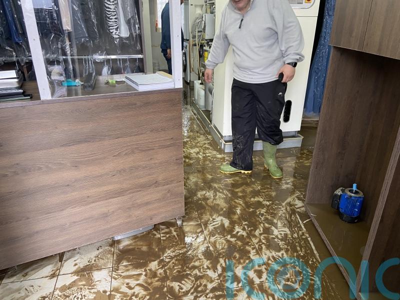 Firefighters rescue people from cars and homes as floods hit north-west