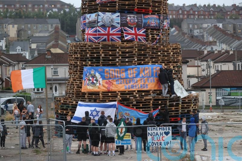 DUP leader condemns placing of flags and images on nationalist bonfire