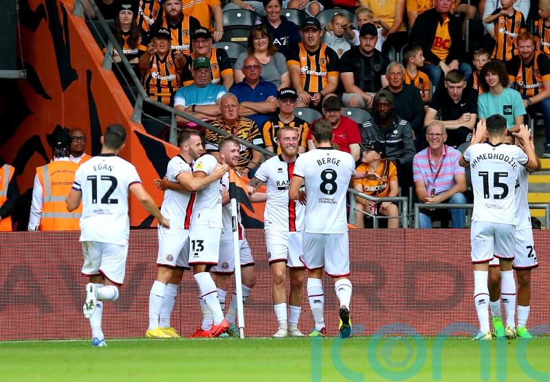 Blades win at Hull to go top of the Championship