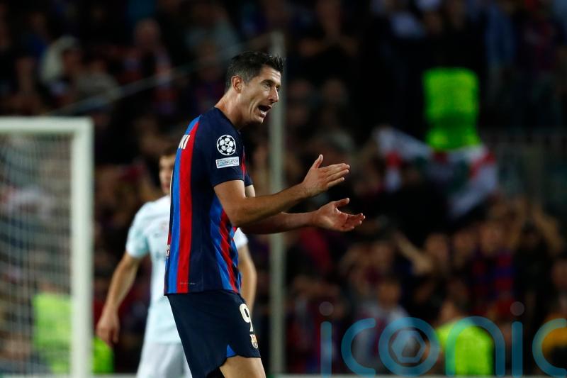 Robert Lewandowski scores late equaliser to give Barcelona Champions League hope