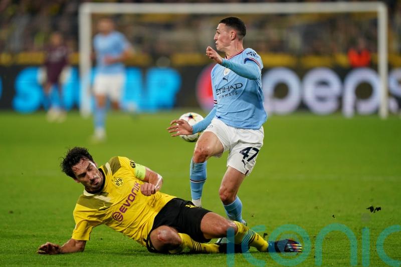 Man City secure top spot in group despite being held by Borussia Dortmund