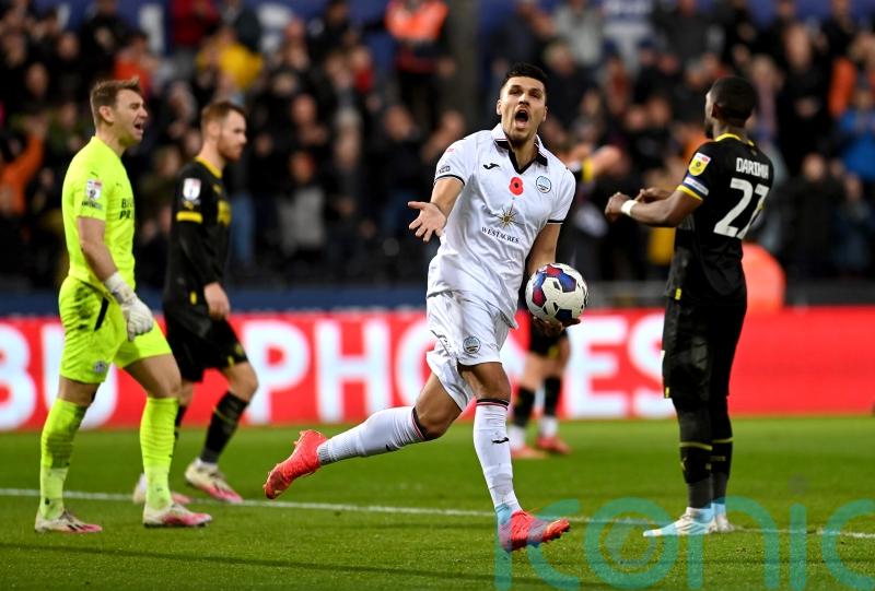 Joel Piroe&rsquo;s late penalty earns Swansea a point after fightback against Wigan