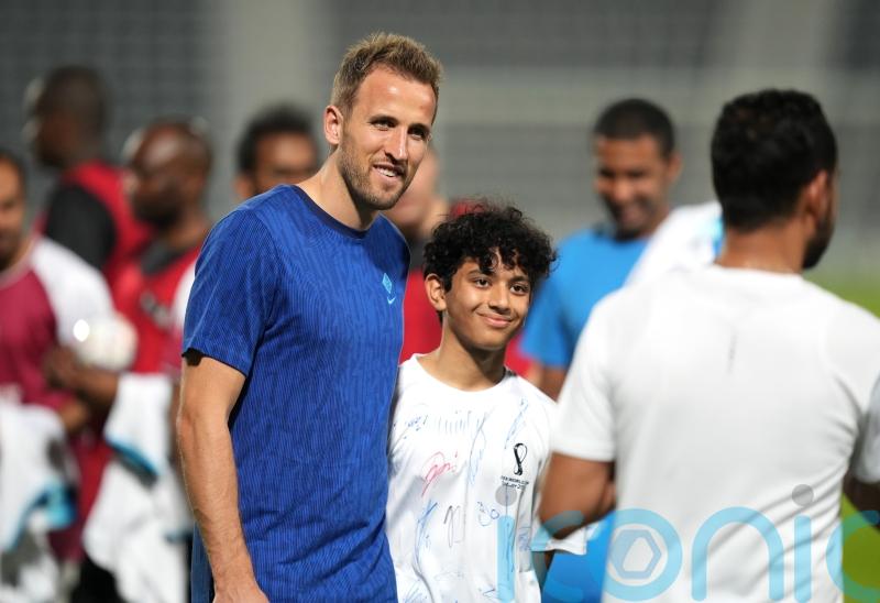 Today at the World Cup: England squad meets migrant workers