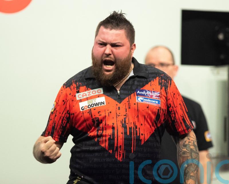 Michael Smith wins first major title after emphatic Grand Slam of Darts victory