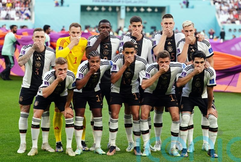 Germany players cover mouths for team photo in protest over OneLove armband ban